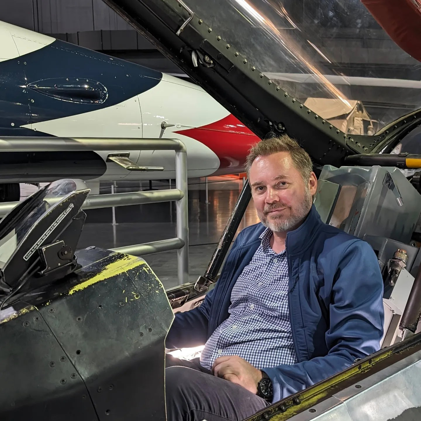Founder Nicki Repenning seated in an aircraft cockpit